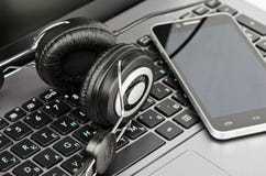 Headphones, keyboard and smartphone Royalty Free Stock Photos Headphones, keyboard and smartphone Royalty Free Stock Photos
