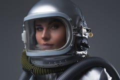 Headshot of modern spacewoman dressed in spacesuit