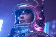 Headshot of spacewoman with helmet in fog