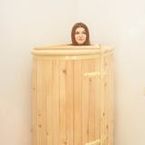 Healing spa treatment in cedar barrel. Young beautiful girl do salon procedure. Health accessories royalty free stock image Healing spa treatment in cedar barrel. Young beautiful girl do salon procedure. Health accessories royalty free stock image