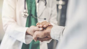 Health worker holding patient`s hand royalty free stock photo Health worker holding patient`s hand royalty free stock photo