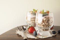 Healthy Breakfast, Oat Meal With Fruits: Bluebery, Strawbery And Min, Parfait In Two Glasses On A Rustic Background. Healthy Food. Royalty Free Stock Photos