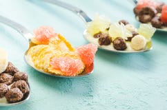 Healthy Breakfast. Yogurt, flakes and fruit in spoons on a blue background royalty free stock photos Healthy Breakfast. Yogurt, flakes and fruit in spoons on a blue background royalty free stock photos