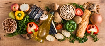 Healthy eating. Mediterranean diet. Fruit,vegetables, grain, nuts olive oil and fish on wood royalty free stock photography Healthy eating. Mediterranean diet. Fruit,vegetables, grain, nuts olive oil and fish on wood royalty free stock photography