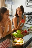 Healthy Eating Women Cooking Salad In Kitchen. Fitness Diet Food stock images Healthy Eating Women Cooking Salad In Kitchen. Fitness Diet Food stock images