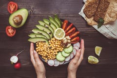 Healthy Food Concept. Hands Holding Healthy Salad With Chickpea And Vegetables. Vegan Food. Vegetarian Diet Royalty Free Stock Images Healthy Food Concept. Hands Holding Healthy Salad With Chickpea And Vegetables. Vegan Food. Vegetarian Diet Royalty Free Stock Images