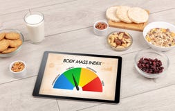 Healthy food with tablet on a wooden background Stock Images Healthy food with tablet on a wooden background Stock Images