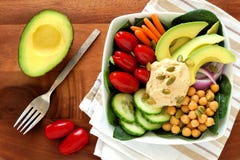 Healthy lunch bowl with avocado, hummus and fresh vegetables royalty free stock photography Healthy lunch bowl with avocado, hummus and fresh vegetables royalty free stock photography