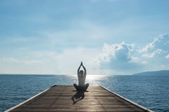 Healthy woman lifestyle balanced practicing meditate and zen energy yoga on outdoors the bridge in morning. royalty free stock image Healthy woman lifestyle balanced practicing meditate and zen energy yoga on outdoors the bridge in morning. royalty free stock image