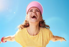 Healthy woman in yellow shirt against blue sky rejoicing Royalty Free Stock Photo Healthy woman in yellow shirt against blue sky rejoicing Royalty Free Stock Photo