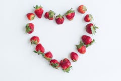 Heart frame made of strawberries on white background. Flat lay, top view, copy space, centered royalty free stock photos Heart frame made of strawberries on white background. Flat lay, top view, copy space, centered royalty free stock photos