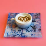 Heart Shape Coffee Cup Concept isolated on pink background. love cup , heart drawing on latte art coffee. square royalty free stock image Heart Shape Coffee Cup Concept isolated on pink background. love cup , heart drawing on latte art coffee. square royalty free stock image