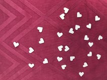 Heart shape white papers on square pattern pink fabric, `valentine`s day†concept stock photography Heart shape white papers on square pattern pink fabric, `valentine`s day†concept stock photography