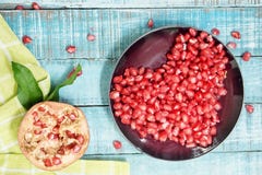 Image result for pomegranate on blue wooden table