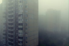 Heavy morning fog and evaporation in the city with high-rise buildings royalty free stock image Heavy morning fog and evaporation in the city with high-rise buildings royalty free stock image