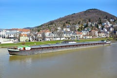 Long transport ship with cargo swimming across Neckar River stock photography Long transport ship with cargo swimming across Neckar River stock photography