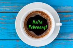 HELLO FEBRUARY - written on morning coffee mug. Top view. Last winter month royalty free stock images HELLO FEBRUARY - written on morning coffee mug. Top view. Last winter month royalty free stock images
