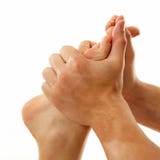Het vrouwelijke die close-up van de massagevoet op wit wordt geïsoleerd stock afbeelding Het vrouwelijke die close-up van de massagevoet op wit wordt geïsoleerd stock afbeelding