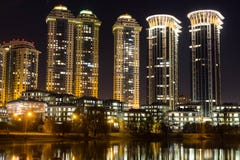 High-rise houses of a residential complex with night lighting. Expensive housing. royalty free stock image High-rise houses of a residential complex with night lighting. Expensive housing. royalty free stock image