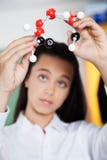 High School Student Looking At Molecular Structure Royalty Free Stock Image High School Student Looking At Molecular Structure Royalty Free Stock Image