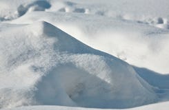 High snowdrift lit by the morning sun royalty free stock photos High snowdrift lit by the morning sun royalty free stock photos