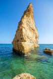 High stone pillar on the coast of the Algarve royalty free stock photography High stone pillar on the coast of the Algarve royalty free stock photography
