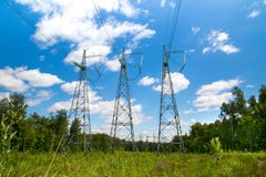 High voltage lines in a forest clearing royalty free stock photo High voltage lines in a forest clearing royalty free stock photo