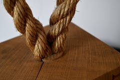 Textured Rope Loop Set in a Wooden Buoy royalty free stock photo Textured Rope Loop Set in a Wooden Buoy royalty free stock photo