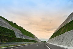 Highway Cut Into Hills Stock Photography