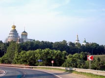Highway past the monastery with a high temple on a Sunny day stock photography Highway past the monastery with a high temple on a Sunny day stock photography