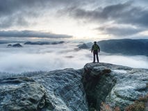 Hike In Autumn Mountains. Man Stay Above Heavy Mist In Valley Stock Image