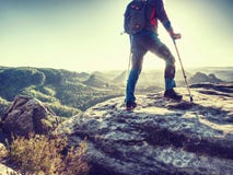 Hiker hold medicine stick,  injured knee fixed in knee feature