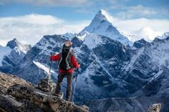 Hiker posing at camera on the trek in Himalayas, Nepal royalty free stock photo Hiker posing at camera on the trek in Himalayas, Nepal royalty free stock photo
