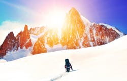 Hiker With Backpacks Reaches The Summit Of Mountain Peak. Success Freedom And Happiness Achievement In Mountains. Active Sport Con Royalty Free Stock Photo