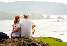 Couple enjoying the company of each other on top of the hill loo Stock Photos Couple enjoying the company of each other on top of the hill loo Stock Photos