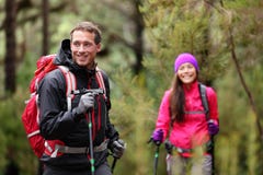 Hiking man and woman on hike in forest on hike stock photos Hiking man and woman on hike in forest on hike stock photos