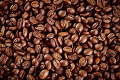 Hintergrund der gebratenen Kaffeebohnen Nahaufnahme lizenzfreie stockfotos Hintergrund der gebratenen Kaffeebohnen Nahaufnahme lizenzfreie stockfotos