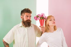 Hipster bearded give bouquet flowers girl excuse gesture. Man with beard apologyes woman. Couple date bouquet flowers stock photo Hipster bearded give bouquet flowers girl excuse gesture. Man with beard apologyes woman. Couple date bouquet flowers stock photo