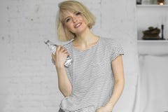 Hipster girl with bottle of sparkling water Stock Photos Hipster girl with bottle of sparkling water Stock Photos