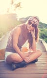 Hipster girl with skate board wearing sunglasses stock image Hipster girl with skate board wearing sunglasses stock image