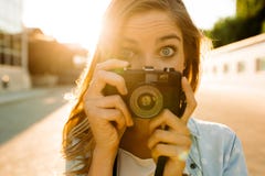 Hipster woman with retro film camera