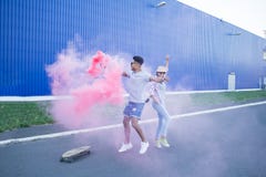 https://thumbs.dreamstime.com/t/hipsters-couple-having-fun-skateboards-young-riding-color-smoke-bomb-boy-girl-casual-clothes-good-time-pink-blue-108603381.jpg