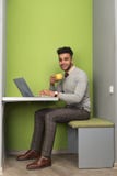 Hispanic Business Man Using Laptop Computer Businessman In Coworking Center Cafe Hold Cup royalty free stock image Hispanic Business Man Using Laptop Computer Businessman In Coworking Center Cafe Hold Cup royalty free stock image
