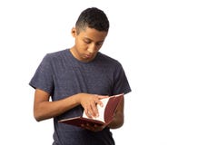 Hispanic Teenager Boy Searching The Pages Of History Book Royalty Free Stock Image