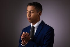 Hispanic Teenager Boy Seeking To Commune With God Via Prayer. Talking With God And Opening His Heart Stock Images