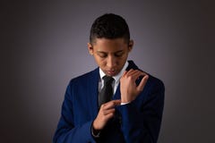Hispanic Teenager Boy Well Dressed Fixing His Shirt Cuff Stock Photo Hispanic Teenager Boy Well Dressed Fixing His Shirt Cuff Stock Photo