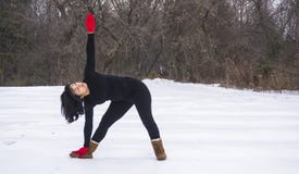 Hispanic woman doing yoga positions outside in winter stock photos Hispanic woman doing yoga positions outside in winter stock photos