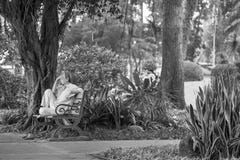 Ho Chi Minh City, Vietnam - September 1, 2018: an undefined man sitting at a corner of the park thinking about something. stock images Ho Chi Minh City, Vietnam - September 1, 2018: an undefined man sitting at a corner of the park thinking about something. stock images