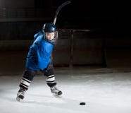 Hockey player ready to make a strong shot stock image Hockey player ready to make a strong shot stock image