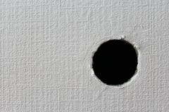 Hole On The White Wall Royalty Free Stock Photography - Image: 21217987